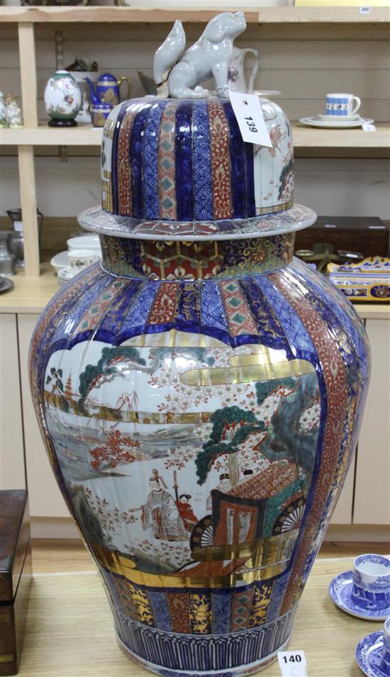 A large Japanese Imari fluted vase and cover, late 19th century, 79cm, broken and repaired